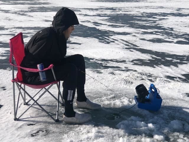 student ice fishing